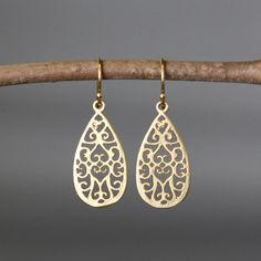 "Beautifully detailed matte gold vermeil filigree teardrop charms simply dangle from gold vermeil balled earwires. Incredibly lightweight, these go-with-everything earrings complete any outfit for daytime or evening. These earrings are also available in silver. Gold charms: 13x26mm Total length of earrings: 1 1/2\" All gold is 18k gold vermeil. As the owner, maker, designer, and curator of this shop, I take great pride in providing you with jewelry that you will love to wear everyday, for specia Elegant Matte Gold Earrings For Formal Occasions, Gold Hypoallergenic Teardrop Bridal Earrings, Gold Teardrop Hypoallergenic Bridal Earrings, Elegant Gold Teardrop Hypoallergenic Earrings, Gold Teardrop Bridal Earrings With Intricate Design, Dainty Gold Teardrop Bridal Earrings, Teardrop Bridal Earrings With Intricate Design, Classic Teardrop Earrings With Intricate Design, Gold Teardrop Earrings With Intricate Design