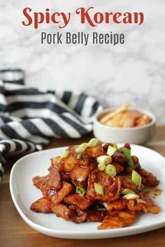 spicy korean pork belly recipe on a white plate