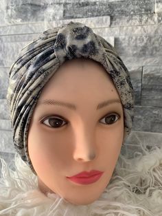 If you like unique turbans and earthy tones this vintage look instant scarf  has literally got you covered. our Stretch Knit Handmade Beige leather look Turban with Black Leopard Spots  is a unique find  An excellent t fashion statement accessory for women~ wear this to add a unique twist to your outfit  The earthy look of the fabric gives it a unique look and makes it stand out . This turban looks just as pictured. You are going to love it ! It's has some silver streaks  that takes it up anothe Adjustable Brown Turban Headband, Adjustable Brown Turban, Adjustable Brown Bohemian Turban, Black Cheetah Print, Knit Turban, Leopard Spots, Beige And Black, Black Leopard, Turbans