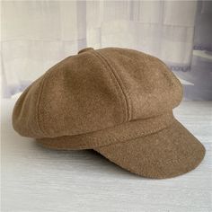 a brown hat sitting on top of a white table