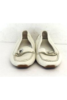 Size 6 EU 36 White Leather Loafers Made in Italy Strap & twist buckle design Silver tone hardware Removable insoles Outsole length 10" Summer Slip-on Loafers With Buckle Closure, Casual Loafers With Buckle Closure, Casual Flats With Buckle Closure Medium Width, Spring Slip-on Loafers With Buckle Closure, Spring Buckle Closure Slip-on Loafers, White Moccasins With Branded Insole, Casual Loafers With Buckle Closure And Flat Heel, Casual Flat Loafers With Buckle Closure, Casual Office Loafers With Buckle Closure