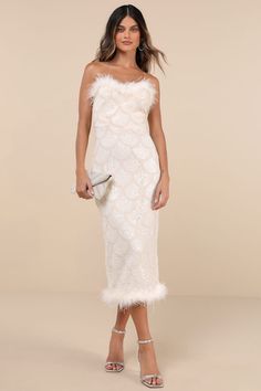 Make your entrance in an event-approved look like the Lulus Uniquely Confident Cream Lace Feather Strapless Midi Dress! Stretchy lace fabric boasts a scalloped design of applique braid, paired with shiny tonal sequins, for an eye-catching effect across this cute dress. Strapless neckline boasts trendy feather trim, with hidden no-slip strips and a fitted waist. Skirt has a figure-skimming effect as it falls to a midi hem with matching feather trim. Kick pleat and hidden zipper/clasp at back. Fit: This garment fits true to size. Length: Mid-calf length. Size medium measures 44" from top to bottom. Bust: Great for any cup size. Waist: Fitted - very fitted at natural waist. Hip: Fitted - stretchy fabric allows room for hips. Undergarments: May be worn with a strapless bra, adhesive bra, petal