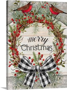 a christmas wreath with two birds on it and the words merry christmas written in red