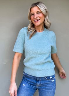 Short sleeve crew neck sweater in a classic blue hue, designed for effortless style and unmatched comfort. This versatile piece is perfect for layering or wearing on its own, making it a must-have addition to your wardrobe. Its lightweight fabric ensures breathability while keeping you cozy. Olivia is wearing xsmall Color: Slate Blue Material: 58% NYLON, 27% VISCOSE, 15% POLYESTER Hand wash cold, Reshape flat dry Crew neck Fabric has good stretch Imported Body length from HPS: 22", Sleeve length Solid Crew Neck Sweater With Soft Texture, Chic Blue Crew Neck Sweater, Casual Snug Sweater With Soft Texture, Trendy Light Blue Crew Neck Sweater, Solid Crew Neck Knit Top For Loungewear, Solid Color Crew Neck Knit Top With Relaxed Fit, Relaxed Fit Crew Neck Knit Top, Soft Knit Casual Sweater, Relaxed Fit Solid Color Crew Neck Knit Top