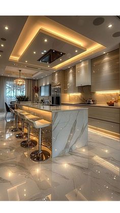 an elegant kitchen with marble counter tops and bar stools in the center, lighted by recessed lighting