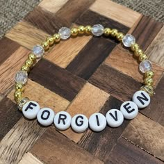 Adorable "forgiven" christian bracelet available in multiple sizes. Gold Personalized Spiritual Beaded Bracelets, Gold Spiritual Bracelets With Letter Beads, Gold Spiritual Bracelet With Letter Beads, Inspirational Adjustable Gold Charm Bracelet, Gold Spiritual Name Bracelet With Letter Beads, Gold Rosary Bracelet With Letter Beads As Gift, Adjustable Personalized Gold Crystal Bracelet, Gold Inspirational Beaded Bracelets As Gift, Inspirational Gold Beaded Bracelets As Gift