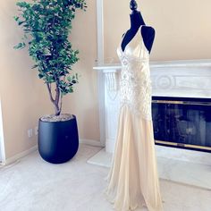 a dress on display in front of a fireplace