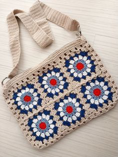 a crocheted purse sitting on top of a wooden table