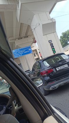 cars stopped at a traffic light on a busy street