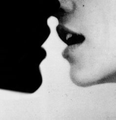 a black and white photo of a woman's face next to a man's nose