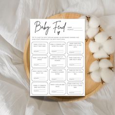 a baby's food list on a plate with cotton floss next to it