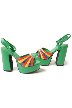 These Jeffrey Campbell Boogie Down Platform Heels feature a platform sandal with ankle strap in a vibrant rainbow of colors, perfect for adding a touch of boldness to any look. With their unmistakable bold 1970s vibe, they're perfect for making a loud and proud statement. Fits half a size small. Order next half size up. Measurements taken from a size 7 5'' heel, 1.5'' platform Fabric / Synthetic Upper, Synthetic Lining, Synthetic Sole Buckle closure 1970s Platform Shoes, 1970s Vibe, 70s Outfit, 70s Clothes, Bold Shoes, 70s Outfits, Clothing And Textile, Antique Clothing, Modern Outfits