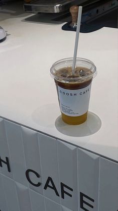 a cup of coffee sitting on top of a counter