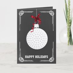 a black and white holiday card with a golf ball