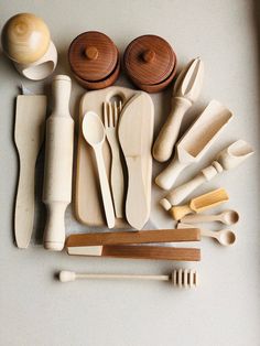 wooden utensils and spoons laid out on a table