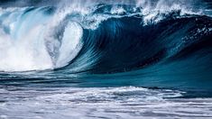 a large wave is breaking in the ocean