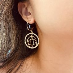 This abstract circles fashion dangle drop earring has a unique statement, features a beautiful crystal stones circles and golden dangle rings which have a nice sound when moving. The design is simple, abstract, modern, and elegant. Wear these fashion statement earrings with your favorite outfit and shine all day long. It's light weight and comfortable to wear. Materials: alloy, rhinestoneFinish: gold color Jewelry Care: See more information about how to care for your jewelry here. Shipping Polic Trendy Alloy Crystal Earrings, Trendy Alloy Hoop Earrings, Trendy Dangle Hoop Earrings In Alloy, Metal Open Circle Hoop Earrings, Trendy Hoop Earrings With Cubic Zirconia, Trendy Pierced Metal Crystal Earrings, Trendy Gold Round Crystal Earrings, Trendy Gold Plated Dangle Hoop Earrings, Metal Round Crystal Earrings