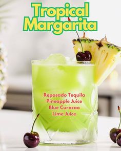 a tropical margarita with pineapple juice and cherries