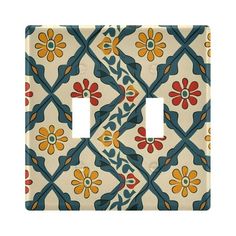 a decorative light switch cover with colorful flowers on it's side and an intricate design