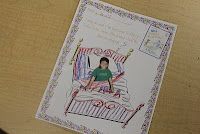 a card with a drawing of a person sitting on a bed