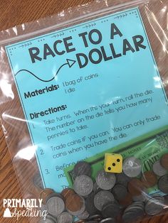 a plastic bag filled with lots of coins on top of a wooden table next to a sign