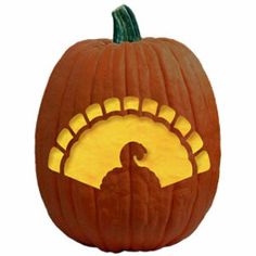 a carved pumpkin with an image of a turkey on it