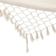 a white hammock with tassels hanging from it's sides on a white background