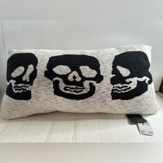 a pillow with two skulls on it