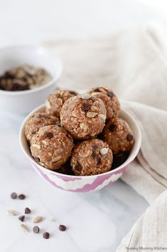 a bowl filled with chocolate chip energy bites