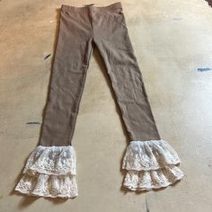 Ml Kids -Ivory Lace Hem Leggings -Stretchy And Soft -Size 7, -Nwot -Pretty Taupe Makes For So Many Outfits Approx. Flat Measurements: Waist, 10.5 Inches Inseam, 23 Inches Hips, 11 Inches Front Rise, 8 Inches Length Of Garment Top To Hem, 30.5 Inches *Smoke Free Home *Feel Free To Ask ?S Cute Cream Cotton Bottoms, Fitted Cream Bottoms With Lace Trim, Beige Ruffled Bottoms For Fall, Cute Brown Bottoms For Spring, Cute Brown Spring Bottoms, Stretch Beige Bottoms With Ruffles, Fitted Beige Footless Bottoms, Beige Stretch Bottoms With Ruffles, Beige Ruffled Stretch Bottoms