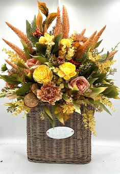 a basket filled with lots of flowers on top of a table