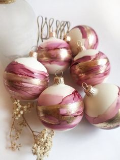 some pink and white ornaments on a table