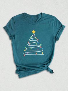 Introducing our adorable Christmas Tree Tee, the perfect addition to your holiday wardrobe! ❄️ Our Christmas Shirt is specifically designed for the festive season, with a delightful Christmas Tree prominently displayed on the front.  This unique design combines the enchantment of Christmas with a touch of winter charm, making it an ideal choice for those seeking a Cute Christmas Shirt to spread joy and merriment during the holiday season.  Crafted for comfort and style, our Christmas Woman Tee is made from high-quality materials, ensuring a soft and smooth feel against your skin. Whether you're attending a Christmas party, staying cozy at home, or simply embracing the spirit of the season, this Light Tree Shirt is a must-have for all Christmas enthusiasts.Christmas Light Tree Shirt, Cute C Christmas Light Tree, Neon Christmas, Light Tree, Cute Christmas Shirt, Halloween Letters, Cute Christmas Shirts, Santa Shirt, Tee Tree, Christmas Tree Shirt