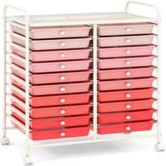 a white rack with pink and red drawers