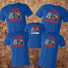 three blue shirts with monster trucks printed on the front and back, one for each child's birthday