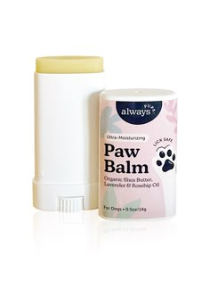 a bottle of paw balm next to a white container