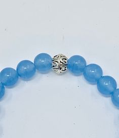 These 8mm Blue Chalcedony beads are a beautiful soft light blue color. The 7.5 inch bracelet has one Pewter spacer bead. It looks great on its own and also stacked with other beaded bracelets. The last picture shows it stacked with other beaded bracelets. The inner diameter of the bracelet is 7 inches. All jewelry comes gift boxed. Thank you for your interet in Gusgusgems.Etsy.com The Last Picture Show, Light Blue Color, Blue Chalcedony, Beaded Stretch Bracelet, Soft Lighting, Spacer Beads, Stretch Bracelets, Beaded Bracelets, Stud Earrings