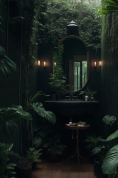 a bathroom with green walls and plants on the floor, along with a sink in the middle