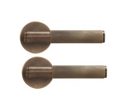 pair of antique brass door handles on white background