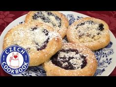 four blueberry filled cookies on a plate