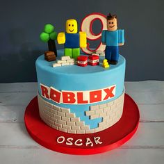 a birthday cake with lego figures on it