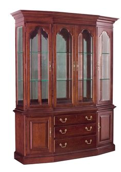 a wooden china cabinet with glass doors and drawers