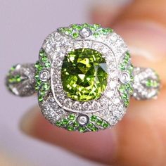 •Condition: Brand new•Center Stone: Natura Tsavorite Green Garnet, Cushion Shape, approx 1.15ct •Side Stone: Natural white diamond, round cut (VS1 clarity and F color)Natural Tsavorite round cut•Ring Weight: 5.62g (depend on the ring size)•Metal Purity: Optional Each piece is made-to-order with care and special attention to detail. all items are made with conflict-free diamonds and gems.Size: made to orderThe item will be gift wrapped and shipped.------------------------------------------------- Luxury Green Sapphire Ring Gia Certified, Green Gia Certified Sapphire Ring, Green Gia Certified Luxury Sapphire Ring, Luxury Green Sapphire Ring With Accent Stones, Oval Green Sapphire Ring With Halo Setting, Formal Green Sapphire Ring With Diamond, Formal Green Sapphire Diamond Ring, Green Oval Sapphire Ring With Center Stone, Green Multi-stone Sapphire Ring For May Birthstone