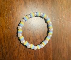 A preppy yellow, green, blue and purple clay bead bracelet with pearls. Very durable, won't break, and looks very cute with any outfit. Purple Clay Bead Bracelet, Preppy Yellow, Bracelet With Pearls, Clay Bracelets, Clay Bead Bracelet, Clay Bracelet, Clay Bead, Clay Beads, Bead Bracelet