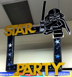 a star wars party sign with a darth vader cut out in the middle