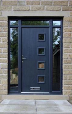 a blue front door on a brick building