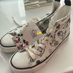 This Pair Of Canvas Shoes From Primark Is A Must-Have Addition To Your Footwear Collection. The Shoes Feature A Fun Disney Character Design That Is Sure To Catch Everyone's Attention. Available In Uk Shoe Size 5, Fitting Size 8 Us Women’s- These Unisex Trainers Are Perfect For Both Men And Women. The Multicoloured Sneakers Are Ideal For Casual Outings, And They Are Customisable To Suit Your Taste. With Its Stylish Design And Comfortable Fit, This Pair Of Primark Disney 100 Canvas Shoes Is Perfect For Any Occasion. Casual White Sneakers With Character Print, Casual Mickey Mouse Lace-up Sneakers, Casual High-top Mickey Mouse Sneakers, Casual Low-top Mickey Mouse Sneakers, Fun Cartoon Print Sneakers With Round Toe, Synthetic Sneakers With Character Print And Round Toe, Casual Low-top Sneakers With Character Print, Disney Character Print Sneakers With Round Toe, Disney Round Toe Sneakers For Streetwear