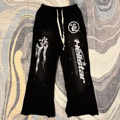 Hellstar Black Yoga Flared Sweatpants Mens Size Large Graphic Print Pants For Winter Streetwear, Wide Leg Pants With Graphic Print For Streetwear, Black Graphic Print Loungewear Pants, Graphic Print Trousers For Streetwear, Black Straight Leg Sweatpants With Letter Print, Black Bottoms With Graphic Print For Winter, Black Graphic Print Bottoms For Winter, Winter Black Bottoms With Graphic Print, Winter Cotton Pants With Graphic Print