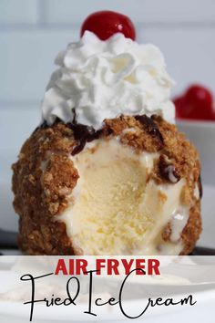 an air fryer fried ice cream dessert on a white plate with cherries in the background