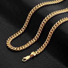 Signature gold electroplating (.50 microns 24 karat gold) Handmade Signature Cuban Link design Solid brass links Available in 18", 20", 22", 24", 26", 28", 30", 32" Inches 9 mm wide Style # CC395